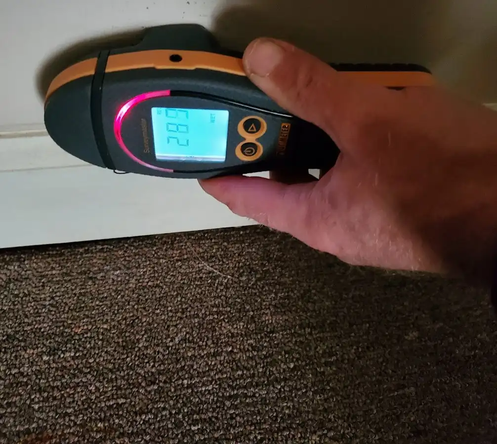 Moisture detection at baseboard during Storm Damage Restoration in Haverhill